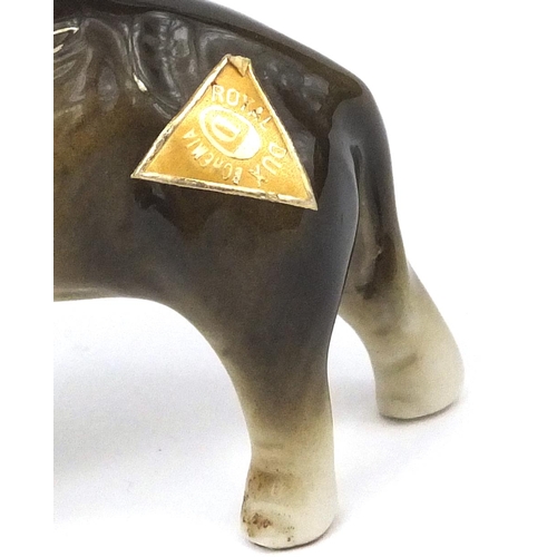 2139 - Graduated set of three Royal Dux elephants, each with original paper labels, the largest 14cm in len... 