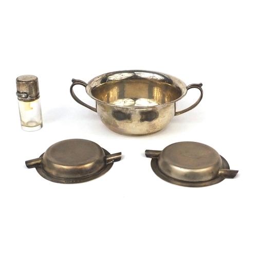 2420 - Silver items comprising twin handled bowl, two circular ashtrays and a glass scent bottle, various h... 