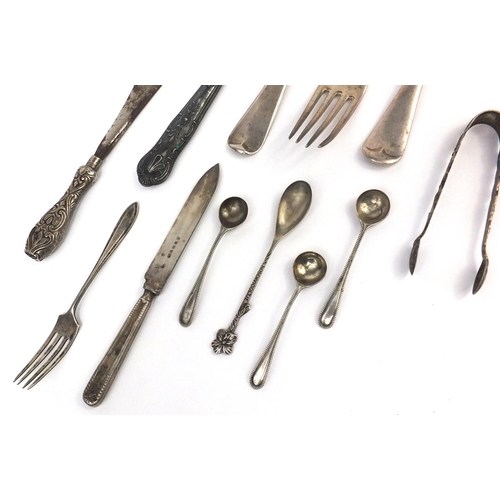 2475 - Silver cutlery including a Victorian table fork, pair of forks, sugar tongs, mustard spoons etc