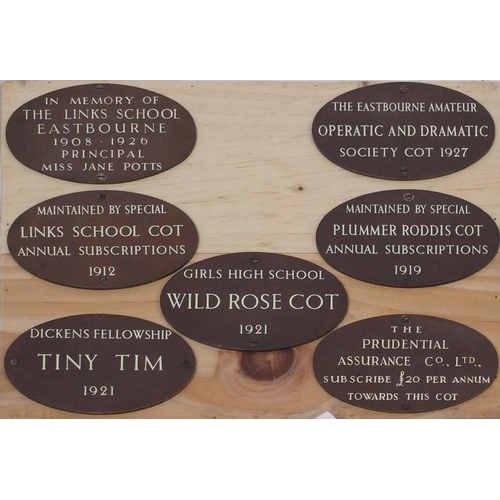 210 - Seven plaques taken from Downside Hospital Eastbourne, together with a nurses uniform from St Marys ... 