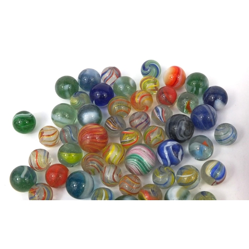 426 - Victorian and later glass marbles, with wooden solitaire board, the solitaire board 26cm in diameter