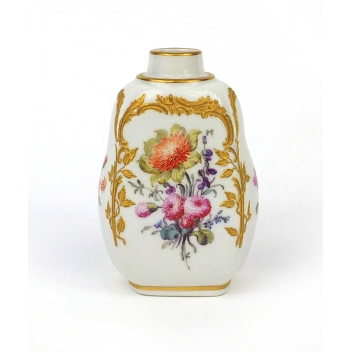 668 - KPM porcelain tea caddy hand painted and gilded with flowers, factory marks to the base, 11cm high