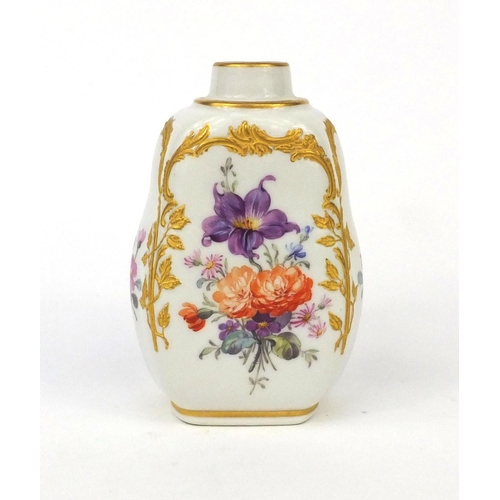 668 - KPM porcelain tea caddy hand painted and gilded with flowers, factory marks to the base, 11cm high