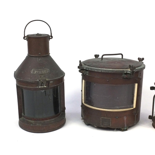 175 - Four copper and glass ship's lanterns including a pair of cylindrical seahorse examples, three with ... 