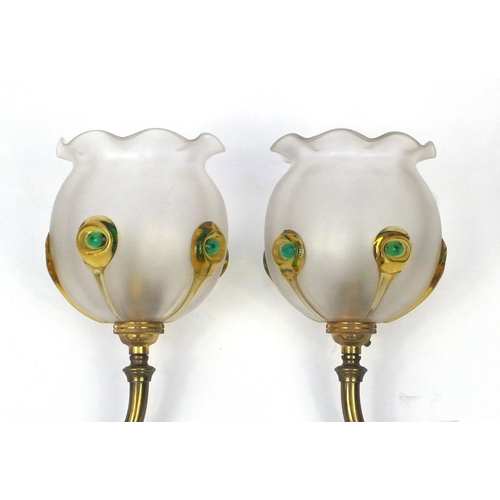 796 - Pair of Art Nouveau brass wall lights, the frilled glass shades with applied decoration, the brass f... 