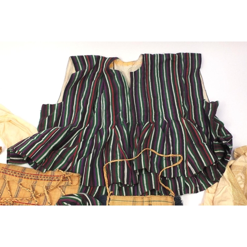 653 - Collection of predominately Nigerian and Ghana traditional clothing and footwear, including embroide... 