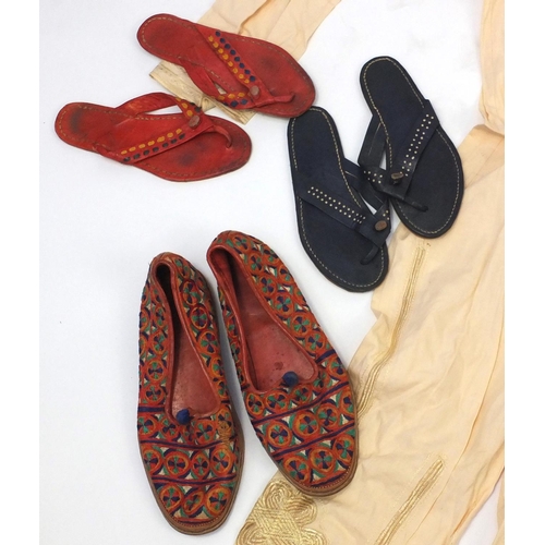 653 - Collection of predominately Nigerian and Ghana traditional clothing and footwear, including embroide... 