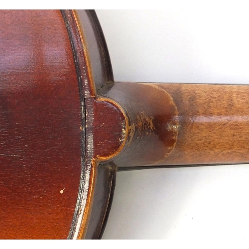43 - Two old wooden violins, both with scrolled neck and ebonised pegs, the largest 66cm in length