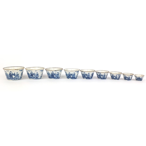 444 - Graduated set of nine Chinese blue and white porcelain bowls, each hand painted with a continuous ba... 