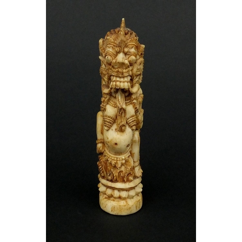 615 - Middle Eastern bone carving of mythical figures, 12cm high