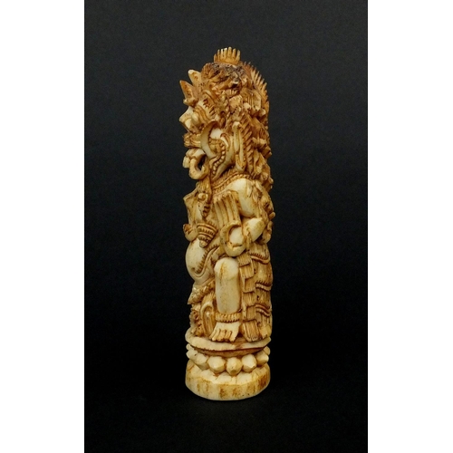 615 - Middle Eastern bone carving of mythical figures, 12cm high