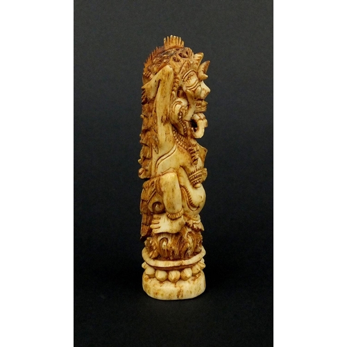 615 - Middle Eastern bone carving of mythical figures, 12cm high