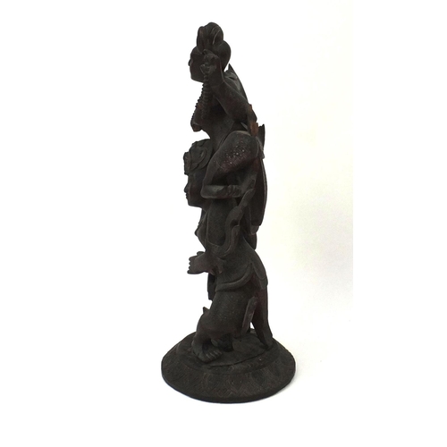 648 - Large Middle Eastern carved wooden figure group of two figures, on a circular base, 77cm high