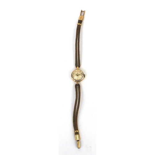 1068 - 9ct gold ladies Omega wristwatch with rope bracelet and 9ct gold clasp, 1.6cm in diameter