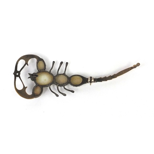 988 - Gilt metal scorpion brooch set with five opals to the body, 7.5cm long, approximate weight 7.0g