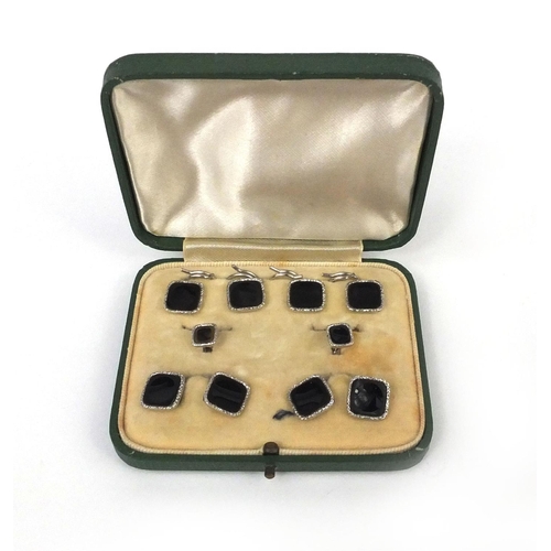 985 - Cased set of 9ct white gold buttons and cufflinks with black enamel decoration, approximate weight 1... 