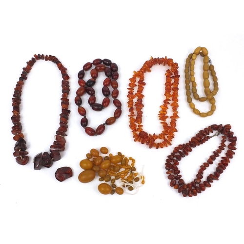 1029 - Selection of amber coloured bead necklaces and loose beads, approximate weight 438.4g