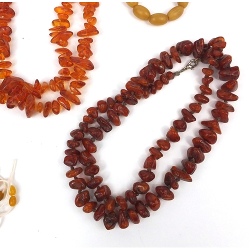 1029 - Selection of amber coloured bead necklaces and loose beads, approximate weight 438.4g