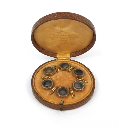 1025 - Cased set of six gilt metal abalone and green enamel buttons, 1.5cm in diameter