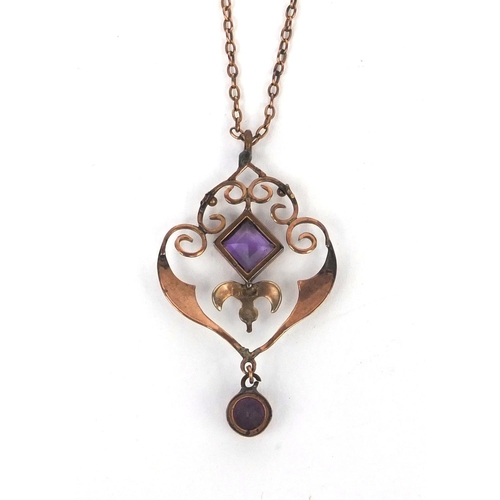 974 - Edwardian 9ct gold amethyst and seed pearl pendant on a gold coloured metal necklace, the pendant 4.... 