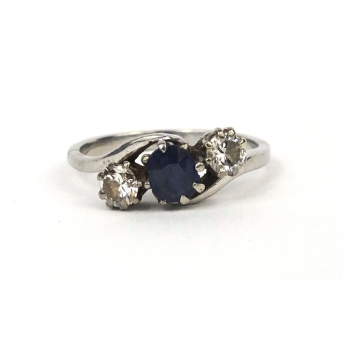 982 - Platinum sapphire and diamond crossover ring, size L, approximate weight  4.0g