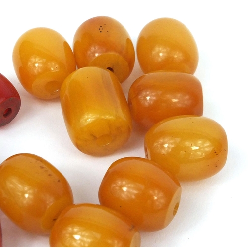 1028 - Collection of butterscotch and cherry amber coloured beads, the largest 2.5cm long, approximate weig... 