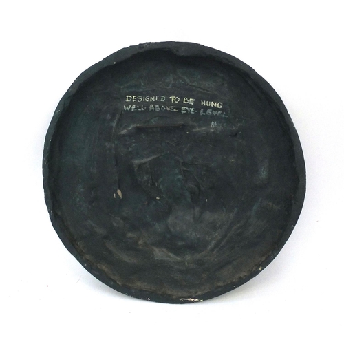 795 - Anne Parker 75 - Circular plaster plaque decorated in relief with figures in a boat, 57cm diameter