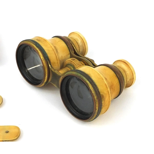 74 - Pair of ivory and brass binoculars together with a pair of ivorine flanked George Butler & Co Sheffi... 