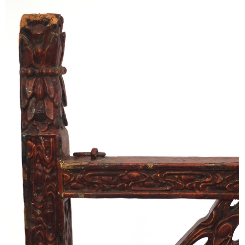 547 - Chinese red lacquered wooden shop hanging, carved with clouse and a dragon, 131cm high