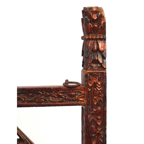 547 - Chinese red lacquered wooden shop hanging, carved with clouse and a dragon, 131cm high