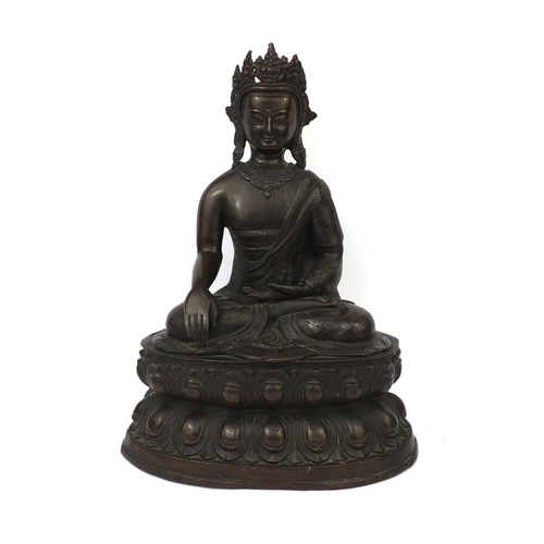 552 - Chino Tibetan bronze Buddha seated in the lotus position, 48cm high