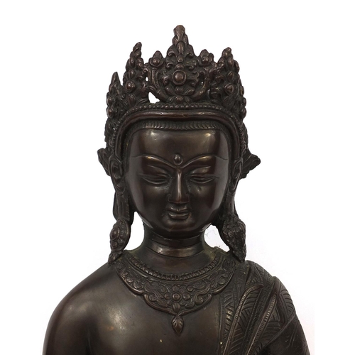 552 - Chino Tibetan bronze Buddha seated in the lotus position, 48cm high