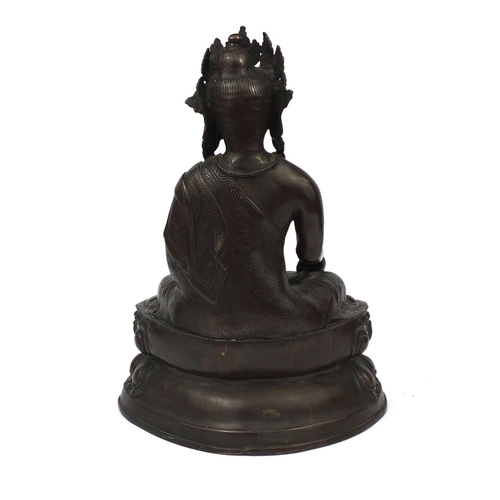 552 - Chino Tibetan bronze Buddha seated in the lotus position, 48cm high