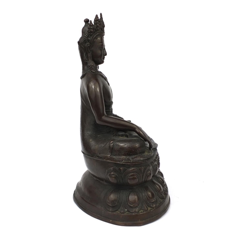 552 - Chino Tibetan bronze Buddha seated in the lotus position, 48cm high