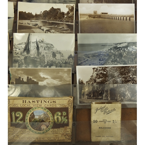 212 - Judges postcard wall display rack containing various local interest postcards including rough sea an... 