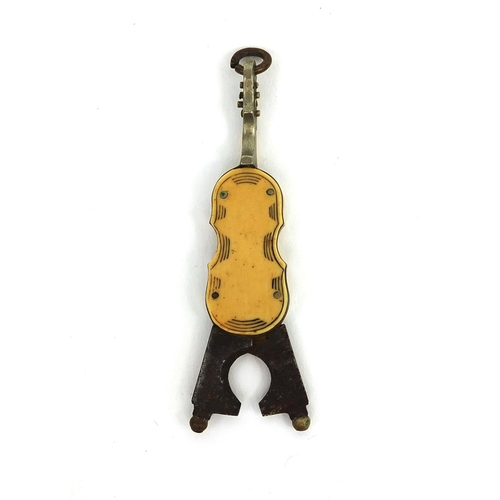 109 - Novelty chatelaine cigar cutter, in the form of a violins, in the form of a violin, 5.5cm in length