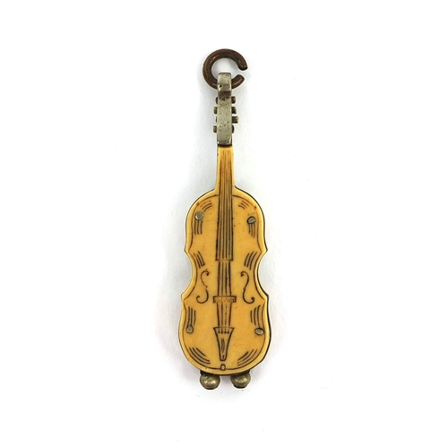 109 - Novelty chatelaine cigar cutter, in the form of a violins, in the form of a violin, 5.5cm in length