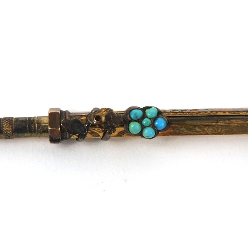 127 - Gilt metal propelling pencil, with turquoise set floral slider and citrine end, length 8.2cm when un... 