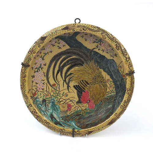 505 - Japanese pottery shallow dish, hand painted with two cockerels amongst trees, 33.5cm in diameter