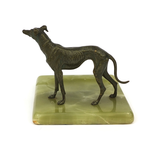 16 - Bronze study of a greyhound mounted on a green onyx ashtray base, 15cm high