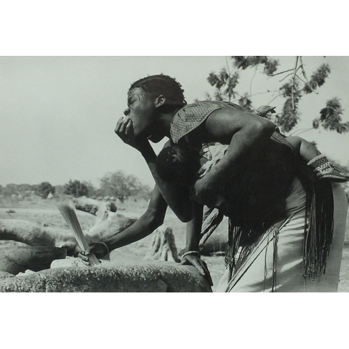 198 - Colin Jones - Upper Volta 1979, black and white photograph of an African man holding a young child, ... 