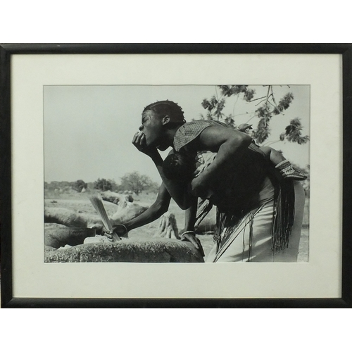 198 - Colin Jones - Upper Volta 1979, black and white photograph of an African man holding a young child, ... 