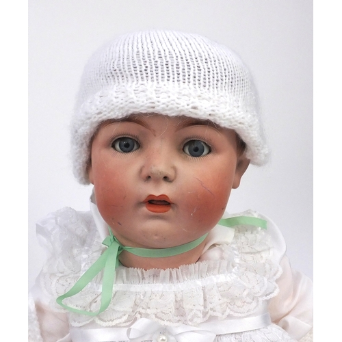 400 - Two large vintage dolls including a bisque headed example with composite limbs, numbered 65 to the b... 