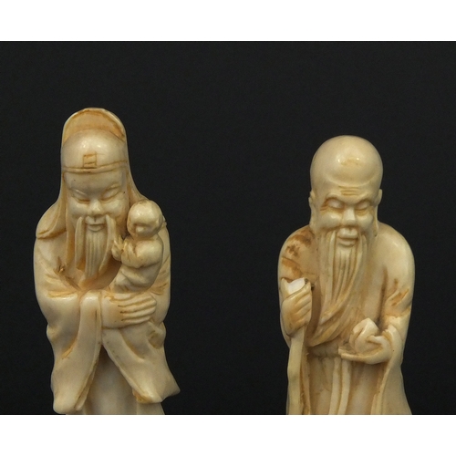 533 - Three Chinese carved ivory figures together with a carved ivory group of three figures below trees, ... 