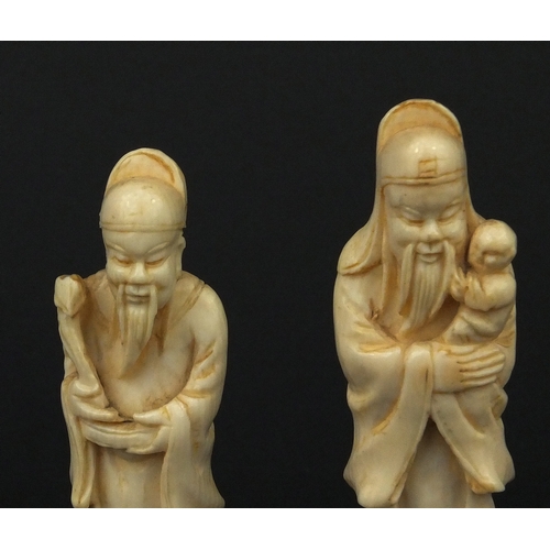 533 - Three Chinese carved ivory figures together with a carved ivory group of three figures below trees, ... 