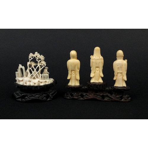 533 - Three Chinese carved ivory figures together with a carved ivory group of three figures below trees, ... 