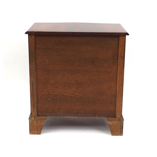 2054 - Reproduction mahogany serpentine fronted five drawer chest with brushing slide on bracket feet, 78cm... 