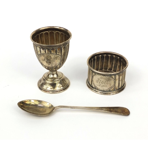 2449 - Silver three piece Christening set comprising an egg cup, spoon and napkin ring with fluted decorati... 