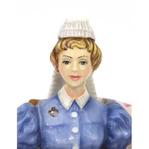 2158 - Royal Worcester figurine, The London Hospital Sister, factory marks to the base, 17.5cm high