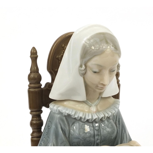 2126 - Lladro figure of a seated female knitting, factory marks and numbered 16 to the base, 29cm high